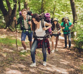 Hard, difficult, tiring and exhausting expedition of four friends in the canyaon, they are climbing up, with backpacks and all needed equipment Hard, difficult, tiring and exhausting expedition of four friends in the canyaon, they are climbing up, with backpacks and all needed equipment